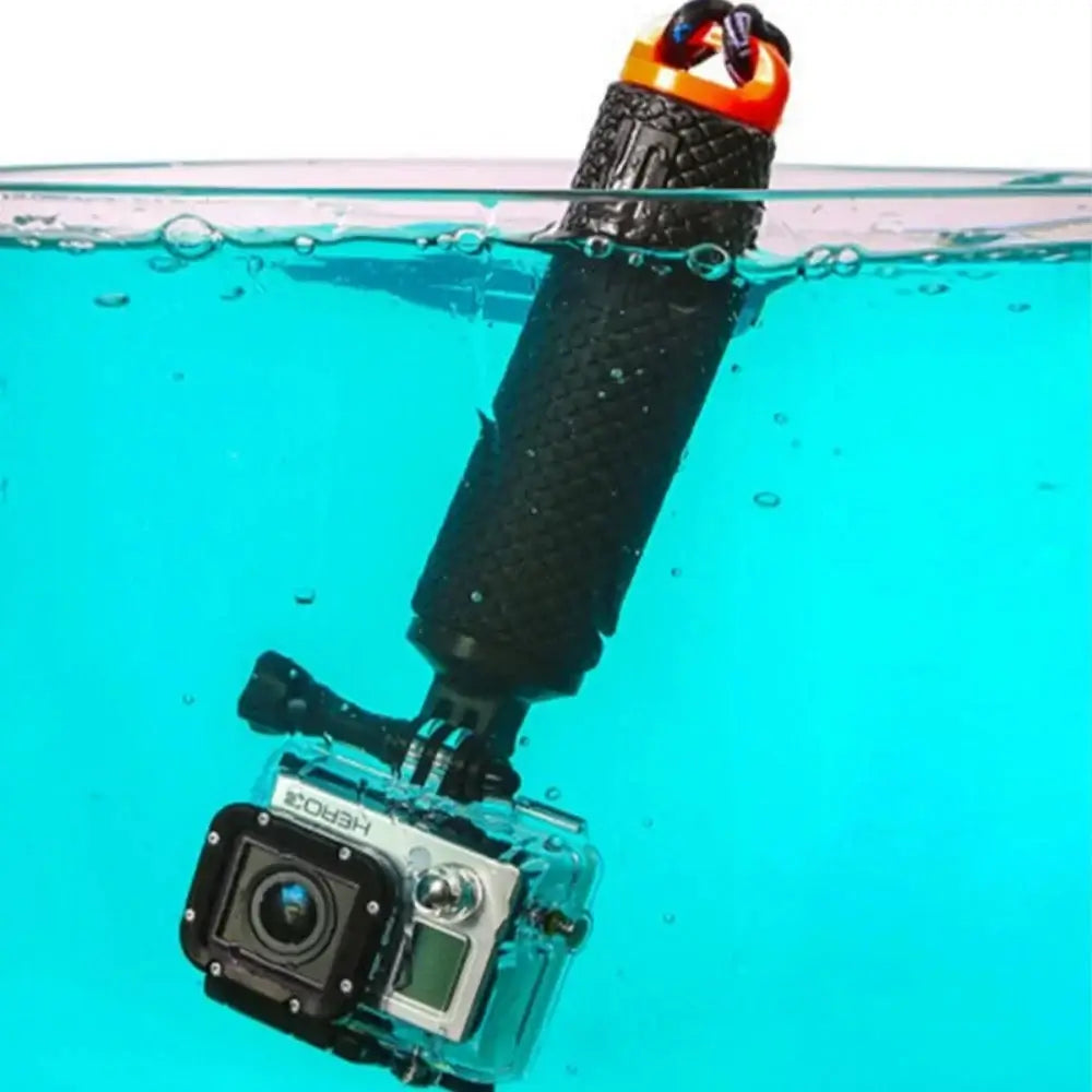 Orange Floating Hand Grip holding an action camera, designed to keep it secure and afloat during water activities.